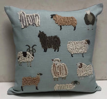 Load image into Gallery viewer, Decorative pillow with embroidered sheep on a light blue background
